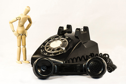 Old Phone and Stick Man - Visualization of Need for Better Business Phone Systems in Davie Florida