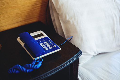 Blue Phone Systems Unit on the Bedside Table of a Ft Myers Hotel